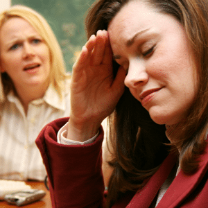 Two women having an argument in an office