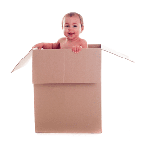 Baby standing in a cardboard box