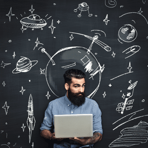 Bearded man with a laptop thinking about space