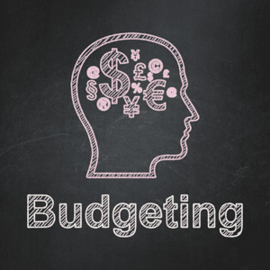 Head with finance symbols and budgeting written on a blackboard