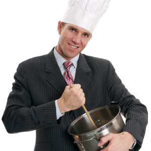 Businessman in chefs hat cooks up a deal
