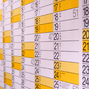 Yellow and white calendar page in month view