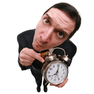 Man pointing at an alarm clock