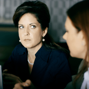 Woman looking annoyed in a meeting