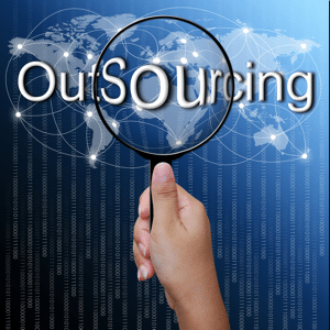 Outsourcing word in magnifying glass with network background