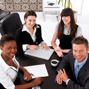 Group of four business people in a meeting