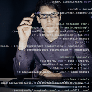 Programmer looking at lines of code on a screen