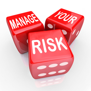 Three red dice reading: Manage your risk