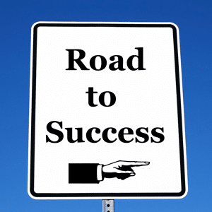 Sign reading road to success