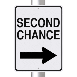 A one way street sign indicating: Second Chance