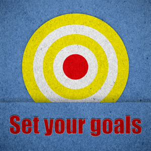 Set your goals written on blue paper