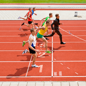 Businessman sprinter winning a track race