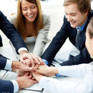 Happy business team with hands together