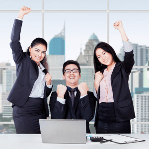 Business team celebrating their success at the workplace